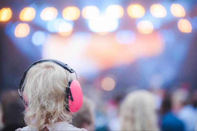 girl-ear-protectors-on-concert